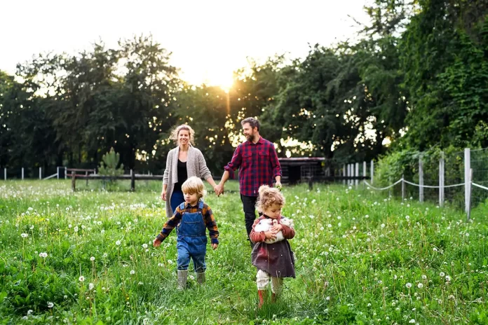 portrait-of-family-with-small-children-walking-on-2021