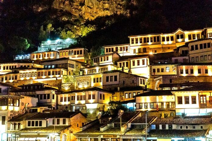 Detail of the beautiful houses of the illuminated historical city of Berat in Albania