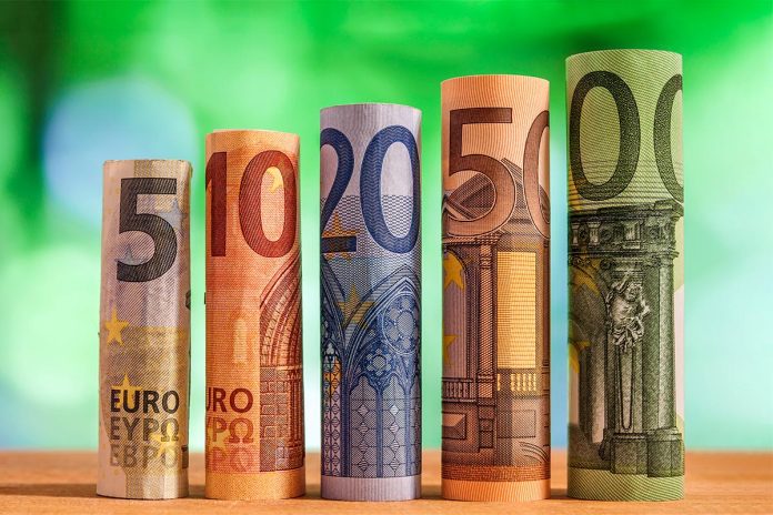 Five, ten, twenty, fifty and one hundred euro rolled bills bankn
