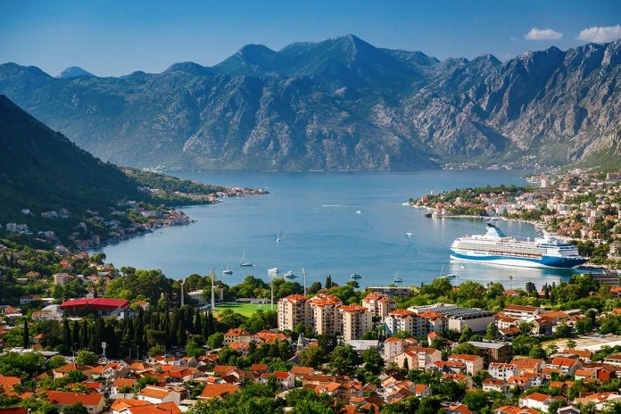 Montenegro's Kotor town and Kotor bay with big cruise ship from