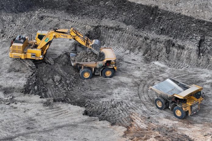 Work,Of,Trucks,And,The,Excavator,In,An,Open,Pit