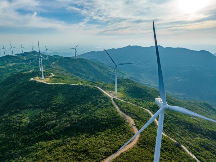 Wind,Farm,On,The,Mountain,,Blue,Sky,And,White,Clouds