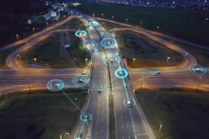 Self-driving,Autonomous,Cars,Move,Along,A,Suburban,Traffic,Intersection,In