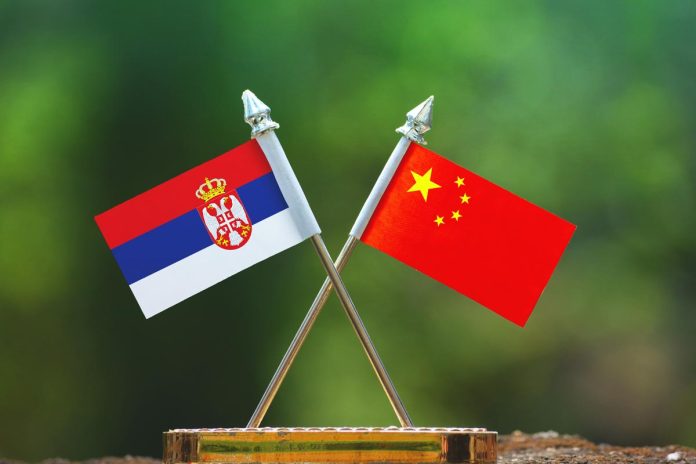 China,And,Serbia,Small,Flag,With,Blur,Green,Background