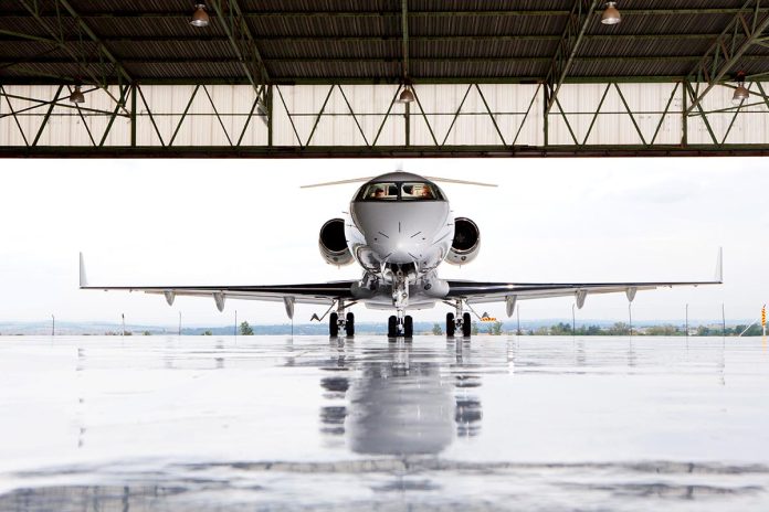 Pilots,In,Private,Jet,In,Hangar