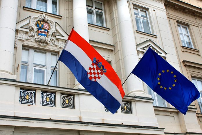 Flags,Of,Croatia,And,European,Union,Against,The,Facade,Of