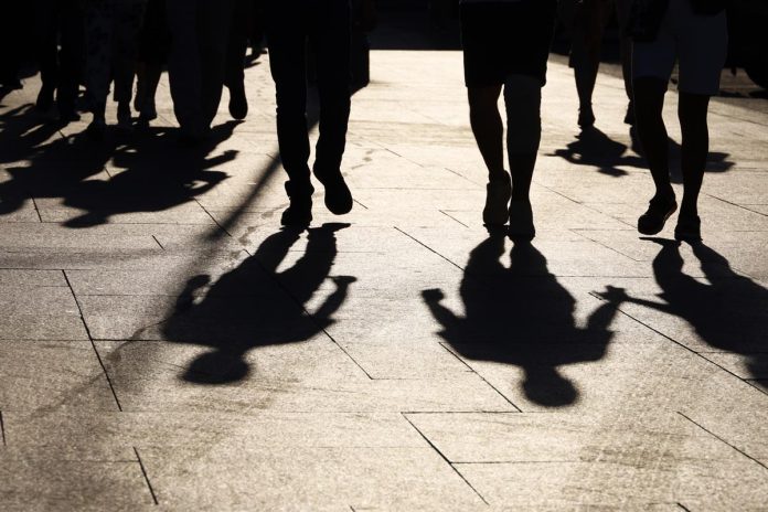 Black,Silhouettes,And,Shadows,Of,People,On,The,Street.,Crowd