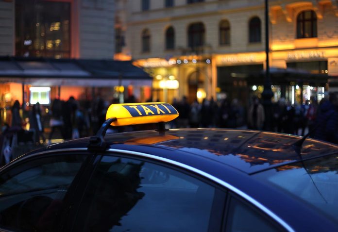 Taxi sign at night