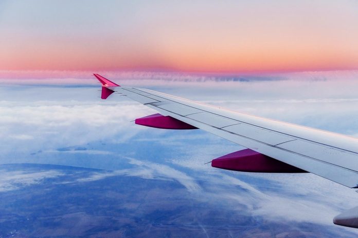 Wing aircraft and a view of cumulus clouds