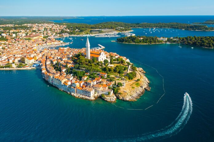 Surroundings of Rovinj and high tower of St. Euphemia church