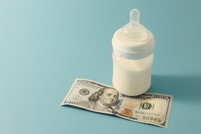 Baby,Bottle,With,Formula,Or,Milk,,Next,To,$100.,The
