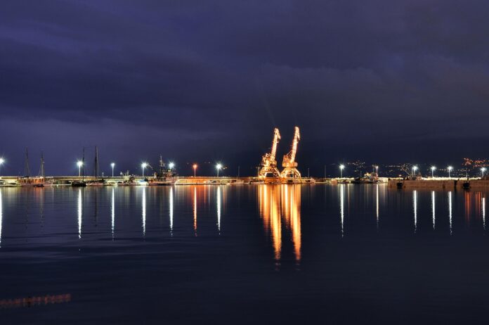 Night,Scene,Of,Rijeka,Port,Cranes,With,Reflections,On,The