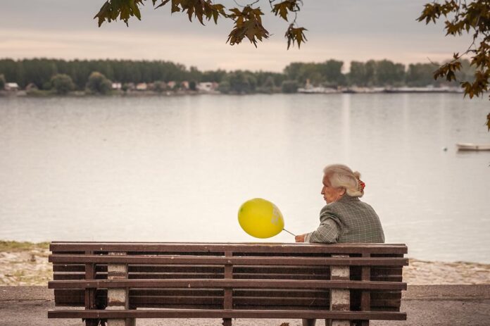 Belgrade,,Serbia,-,March,12,,2024:,Elderly,Woman,Holding,Balloon