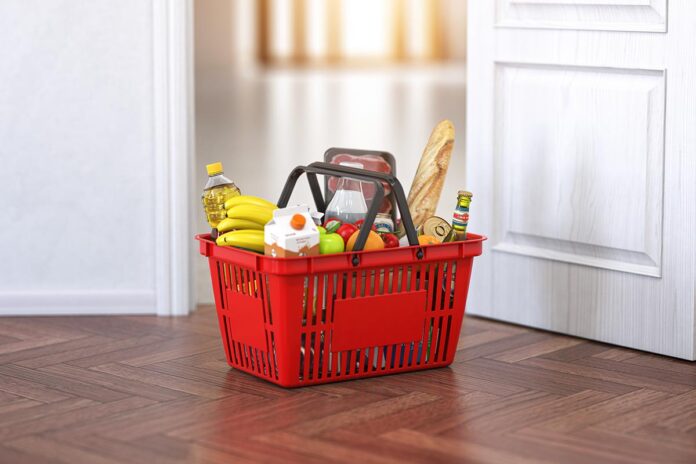 Food and eats delivery concept. Shopping basket with grocery in