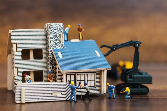 miniature-people-worker-team-for-building-home-2025