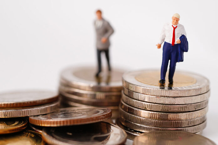 business-man-miniature-people-stand-on-coin-and-ca-2026