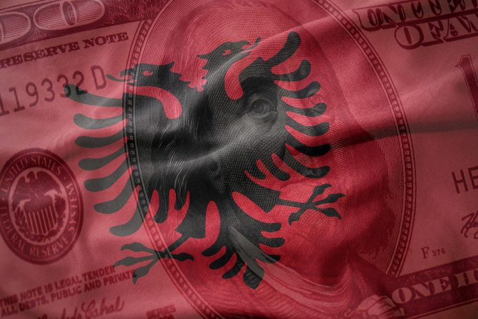 Waving,Colorful,National,Flag,Of,Albania,On,A,American,Dollar