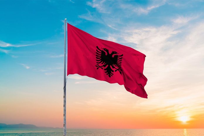 Waving,Flag,Of,Albania,Against,The,Background,Of,A,Sunset