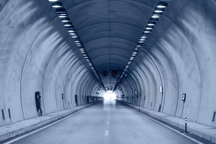 Highway,Road,Tunnel,With,Car,Light