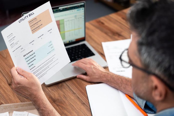 Aged,Man,Pays,For,Utility,Bill,With,Online,Banking,Working