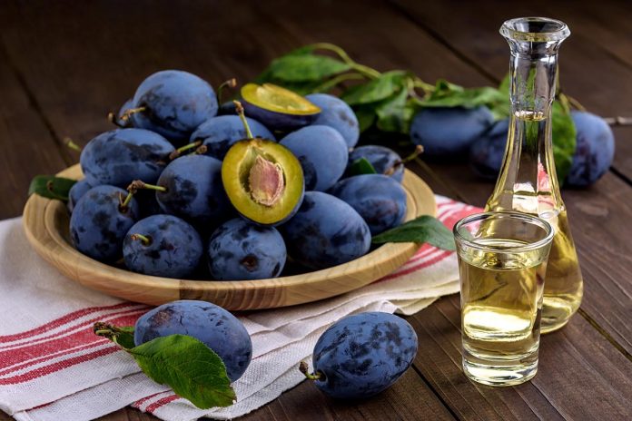 Rakia and plums shutterstock_1940532631