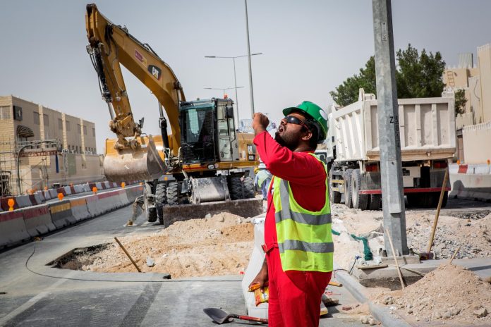Doha,,Qatar,-,July,27,,2019:,Construction,Workers,On,Duty