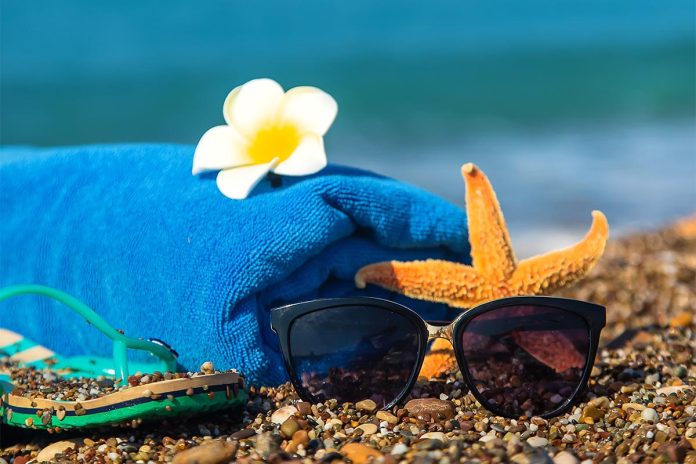 Accessories on the beach by the sea. Selective focus.