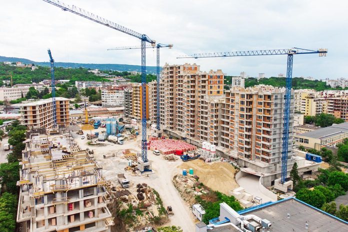 Busy Construction Site and Construction Equipment Aerial view
