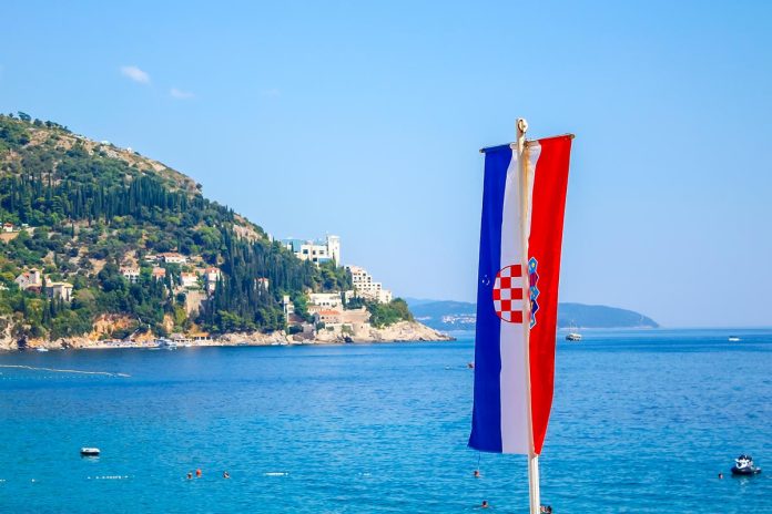 Dubrovnik, Croatia »; August 2016: Flag of the country in the Dubrovnik Sea