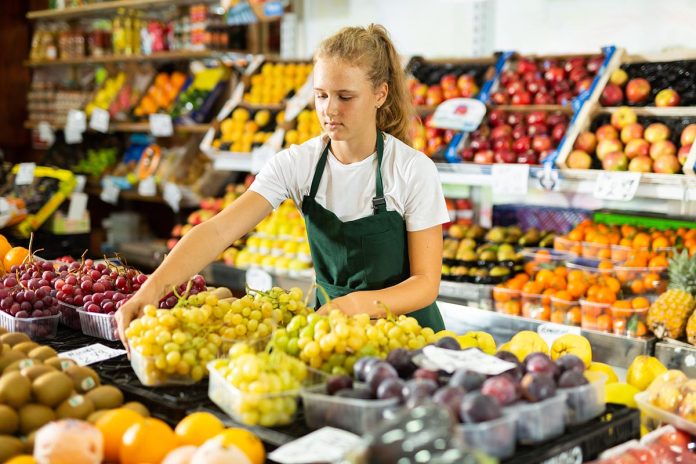 Young,Salesgirl,At,Her,First,Job,,Selling,Green,Grape,And